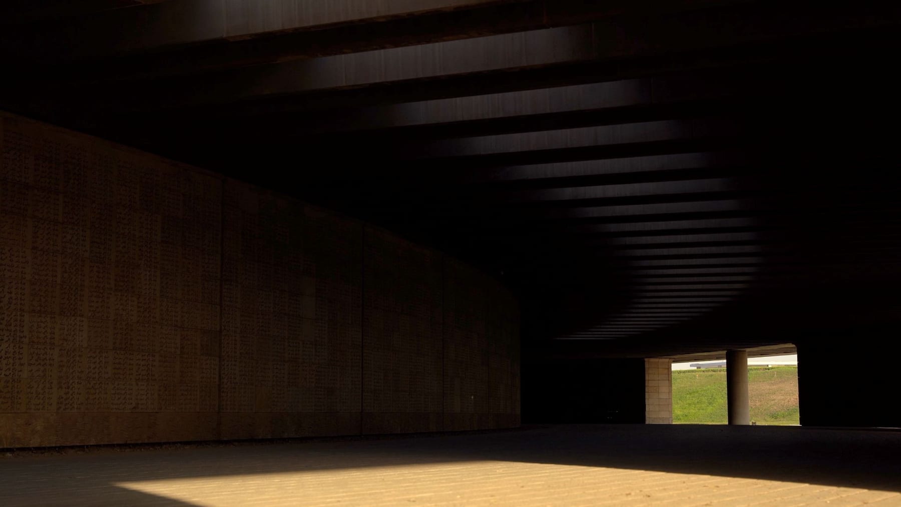 Light falling through the opening of a dark, cavernous interior — from An Archive of Future Memories