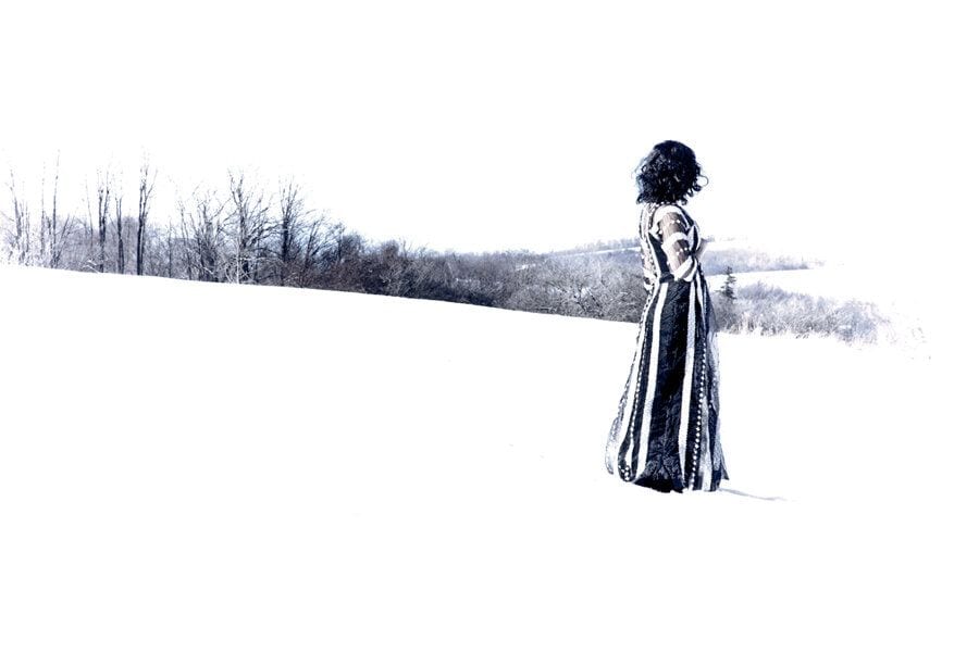 A figure crosses a white winter field, footprints trailing behind — Baghdadi Mem/Wars, Absence/Presence