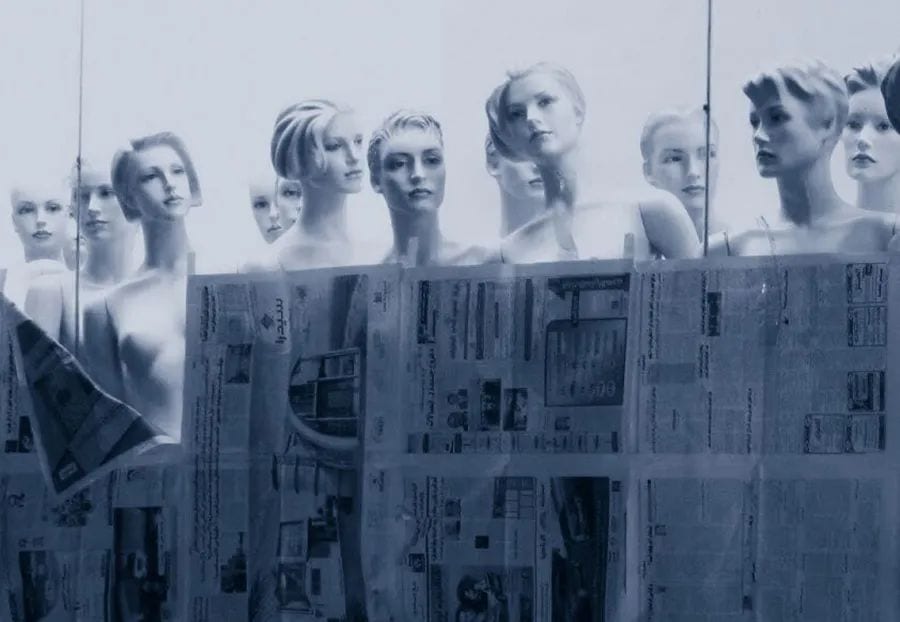 A blue-toned composite of mannequins behind printed newspaper — This Stays Between Us